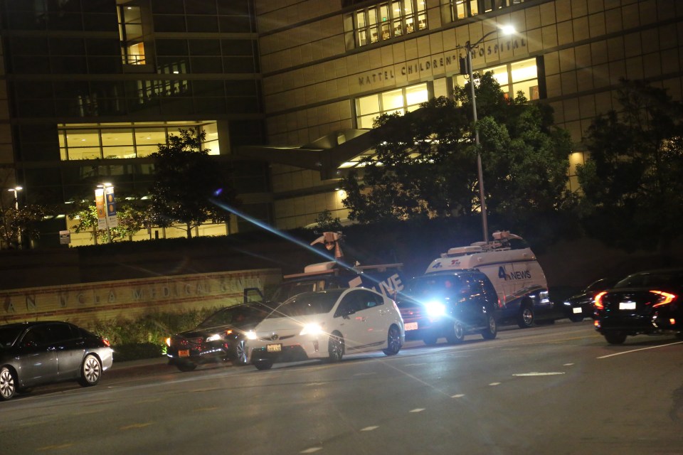  A convoy of cars and media have begun to gather outside the hospital