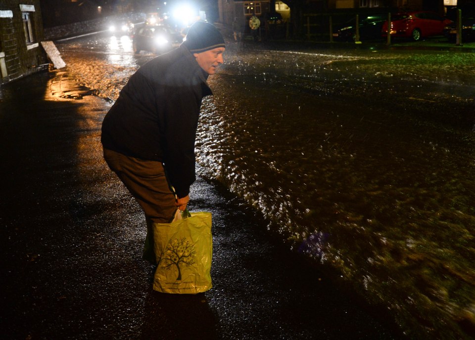  This resourceful Mossley resident used plastic carrier bags instead of wellies