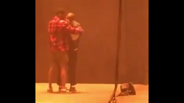  Kanye hugs Kid Cudi before his meltdown at a gig in Sacramento, California