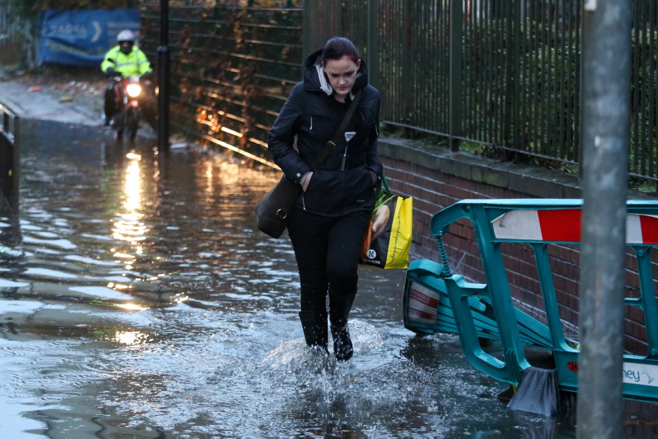  Locals struggled to get to work through the floodwater this morning