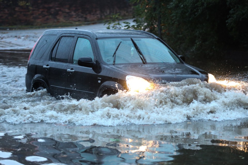  A river in Rotherham burst its banks as Storm Angus dumped torrential rain across much of the UK