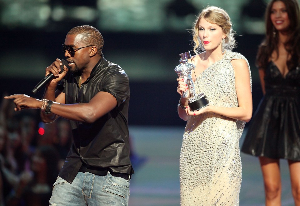  Kanye jumps on stage as Taylor Swift prepares to give a speech at the MTV VMAs