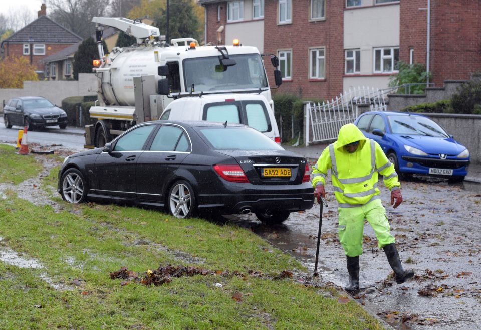  Council staff have been working to clear drains in the street after it was suddenly overwhelmed by a flash flood