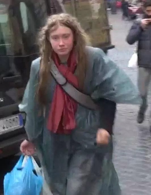  The unidentified woman is seen walking the streets of Rome