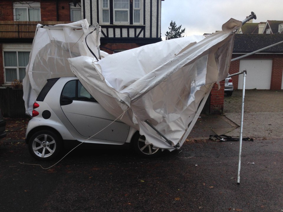  A small marquee appeared from nowhere and landed on top of a Smart car in Bexhill, Sussex