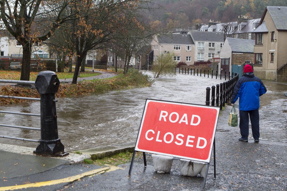  Eddleston Water, Peebles in the Scottish Borders breaks it's banks and threatens to flood properties as heavy rain hits many parts of the UK