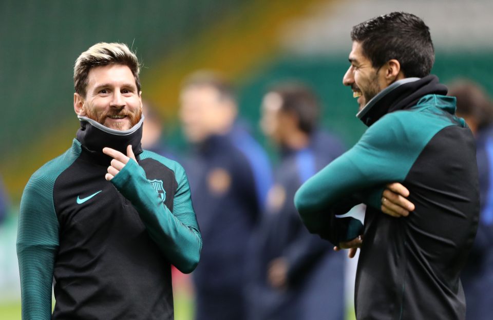  Lionel Messi and Luis Suarez feel the chill in the Glasgow air ahead of their Champions League clash with Celtic