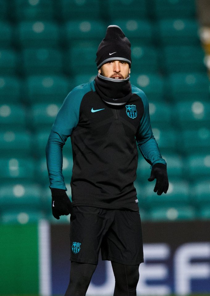  Barcelona left-back Jordi Alba wraps up warm at Celtic Park