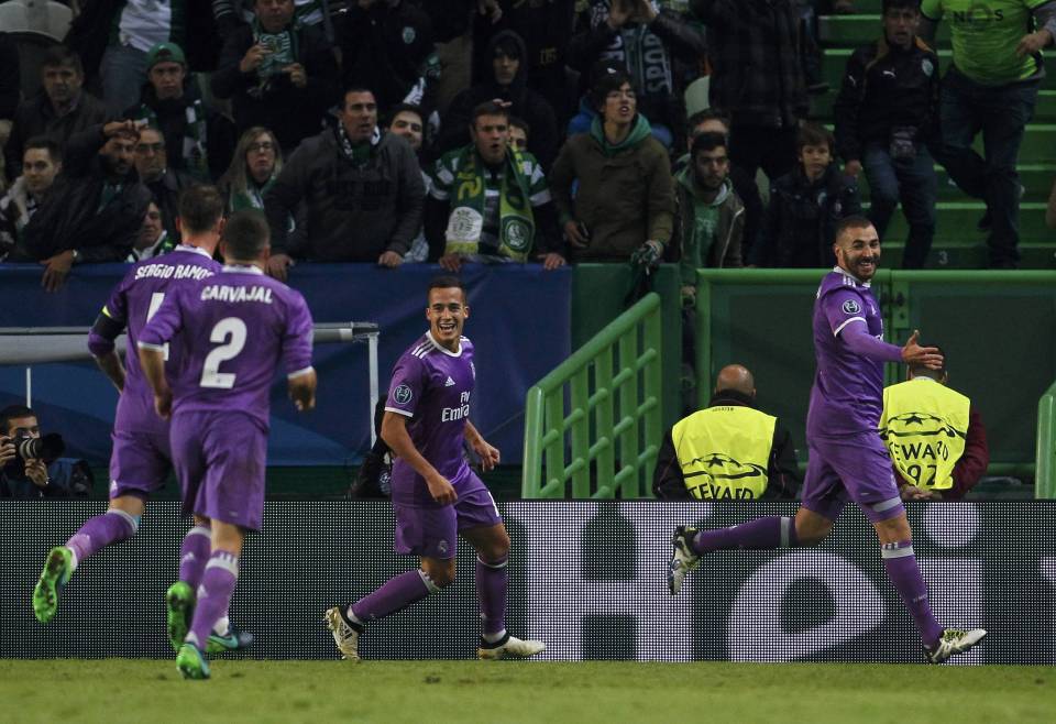  Karim Benzema wheeled away in celebration after saving Real Madrid's blushes