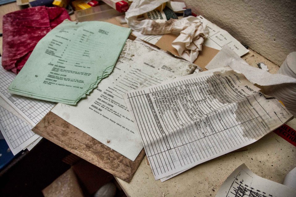 Documents remain sprawled out on a desk within the bunker - many completely untouched since it was last staffed