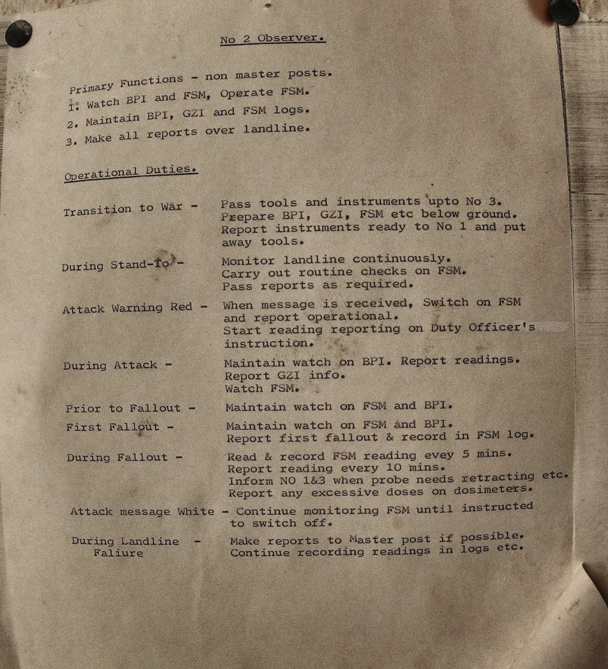 On the walls are three sets of instructions for volunteers - including details of what should be done in the event of a nuclear attack