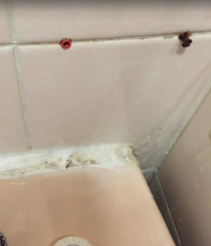  Shocking photographs show the extent of neglect to the interior of the hotel, with electrical sockets broken and brown sludge seen covering the shower cubicles