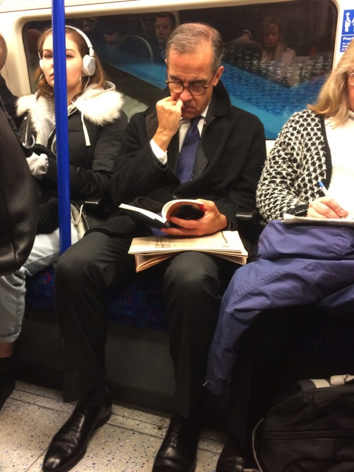  Mark Carney, pictured reading this morning on the tube. Credit: Twitter