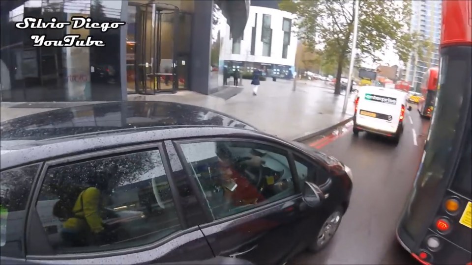 When the cyclist catches him up at traffic lights he approaches him to remonstrate about his actions