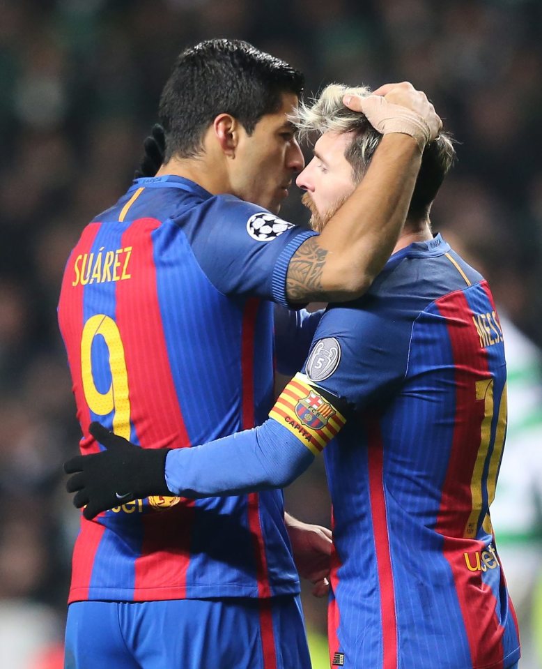  The Argentine wizard celebrates with team-mate Luis Suarez who was brought down for the penalty