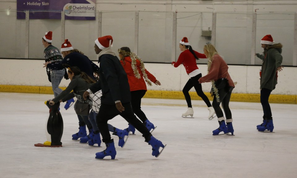  Towie cast on the rink wearing Christmas hats and tinsel