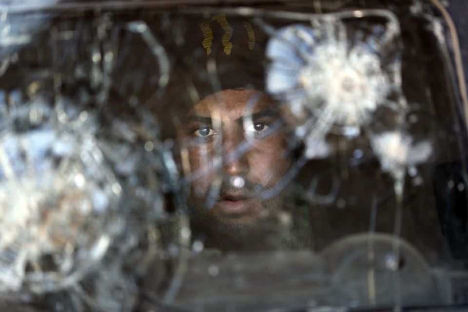  Gunfire... Bullets cracked the screen of this Iraqi armoured vehicle