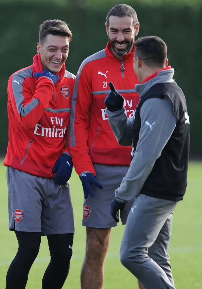 Robert Pires shares a joke with Mesut Ozil and Alexis Sanchez