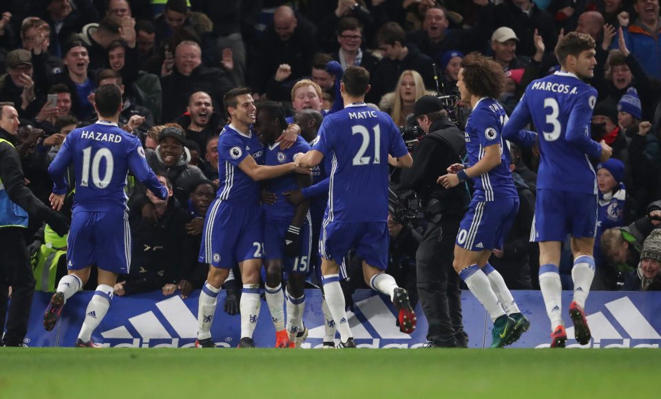  Chelsea celebrate with Victor Moses after he tucked home the winner