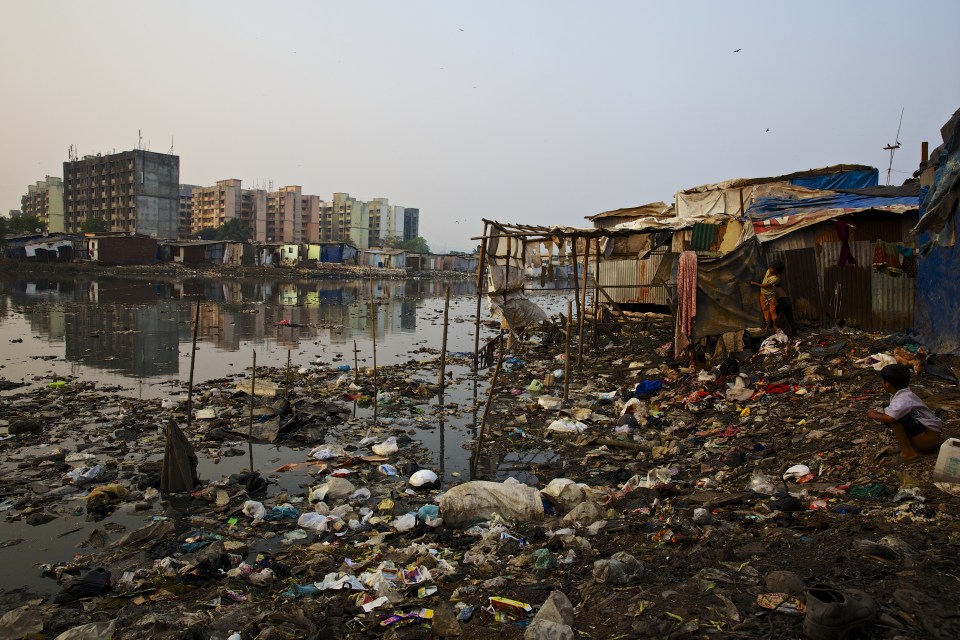 A contrast of slums and apartment buildings.