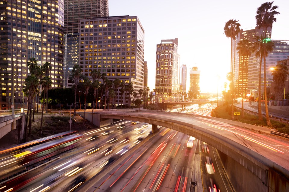 traffic through urban with sunset in los angle