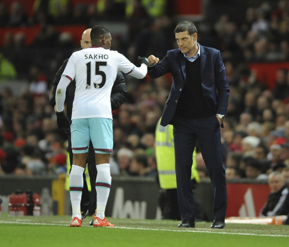  Sakho celebrates his opener with West Ham boss Slaven Bilic