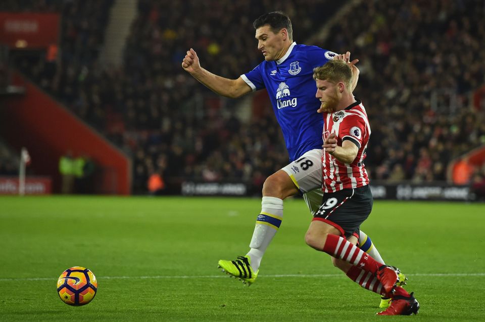  Sims tussles for possession with Gareth Barry