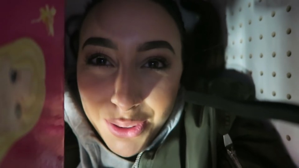  Vlogger Yasmin clambers onto a shelf ahead of the lights going out in Toys "R" Us store