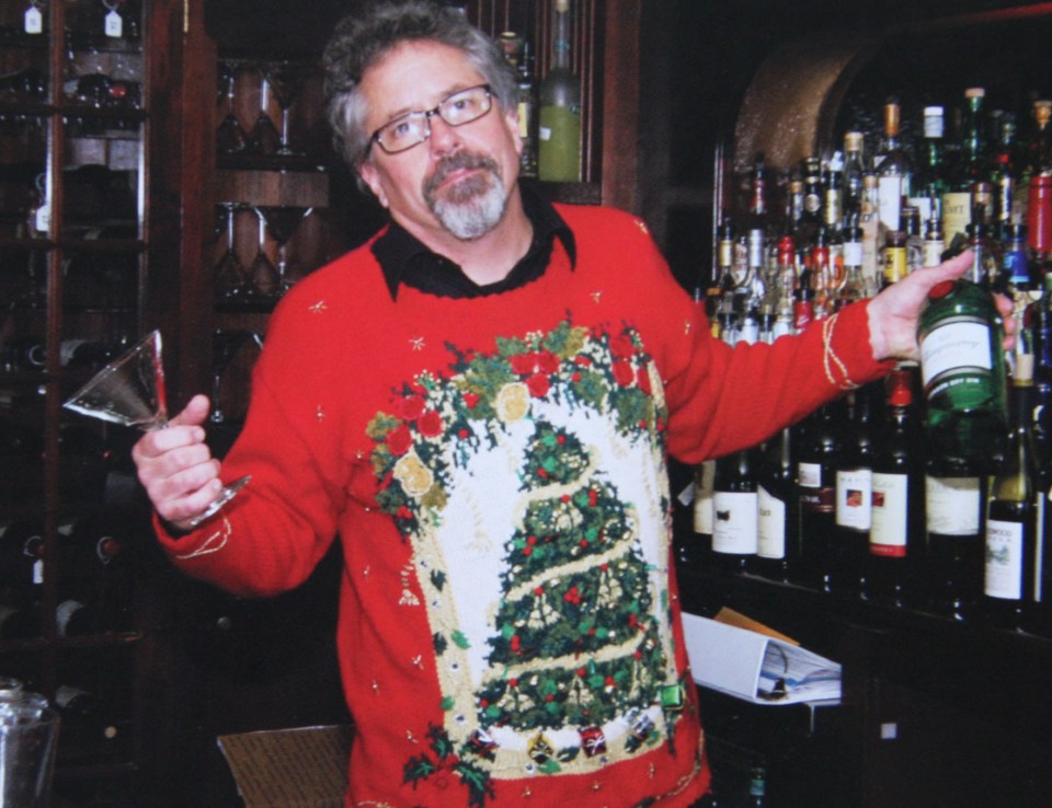  Luckily he is surrounded by wine to make the fact he's wearing that jumper a bit more bearable