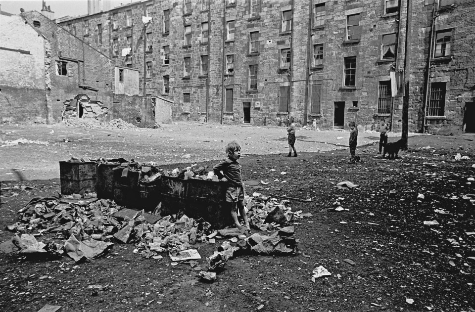  A child playing in tenement courtyard Maryhill Glasgow 1971. This image was used in the Regional Scotland Exhibition