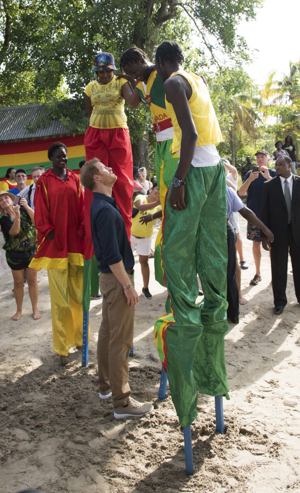  Prince Harry hanging out with his new stilt-walking pals