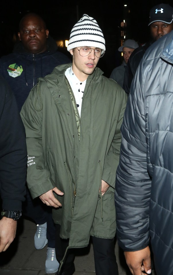  Justin pulled a big winter coat over his suit as he left the nightclub