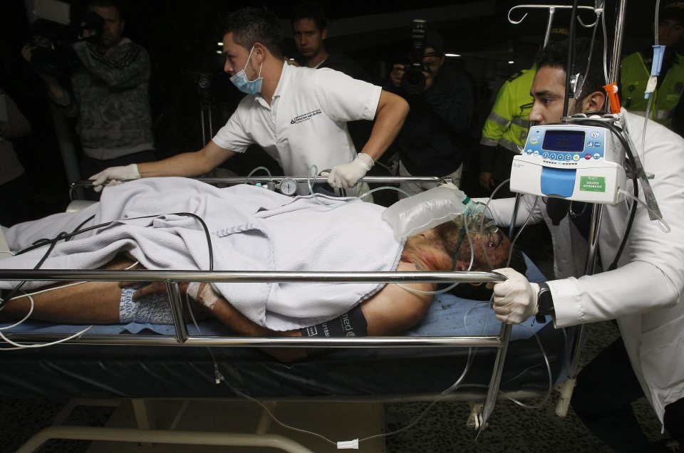 Staff from San Juan de Dios hospital transfer 27-year-old Brazilian soccer player Alan Ruschel as he arrives to La Ceja