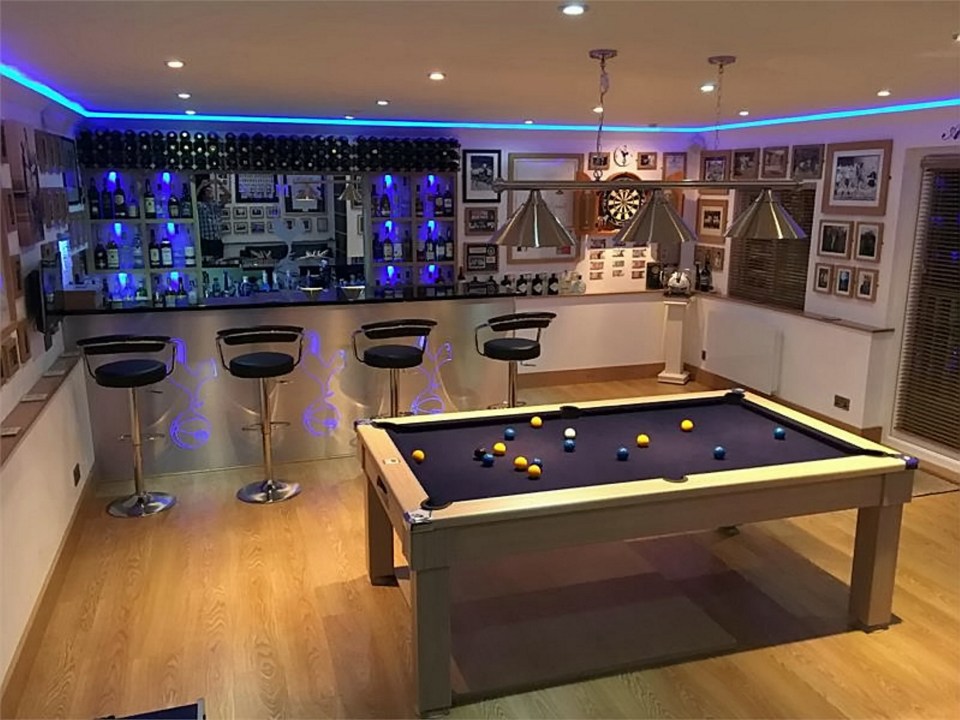 A staple of any man cave is a fully stocked bar, and Darron's games room is no different