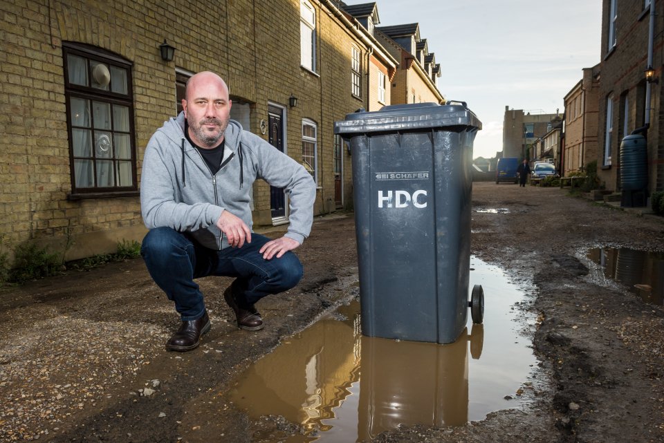  Residents of West Street, St Neots, have been told they will have to pay fees if binmen trip on potholes on their road