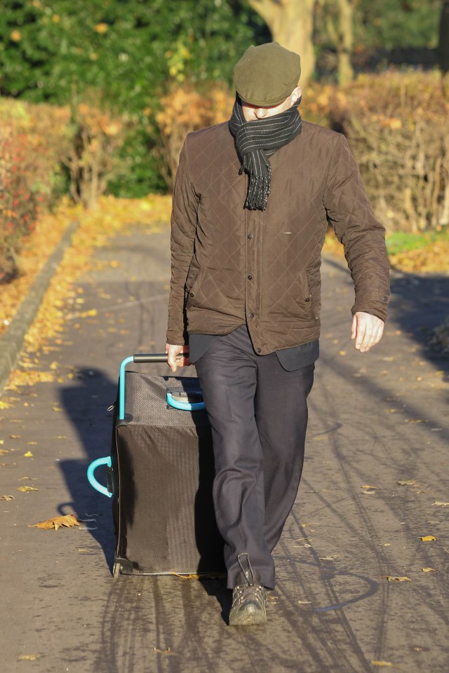  Simon Ball pictured trying to hide his face as he arrives at Peterborough Crown Court for sentencing this morning