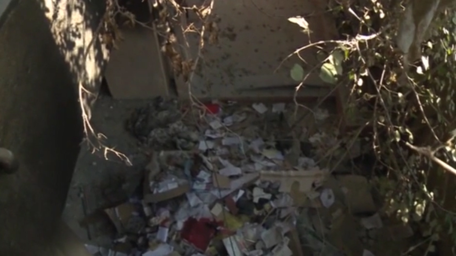  Smashed glass and rubble was littered over the floor of the jail which was disguised to look like other houses on the street