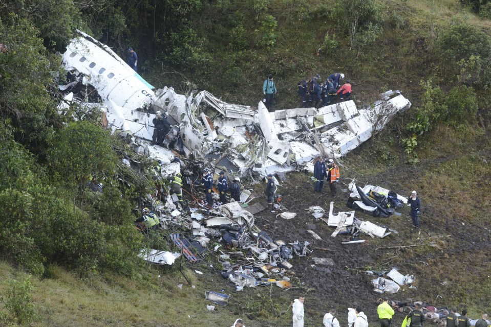  Rescue workers search for survivors at the wreckage site