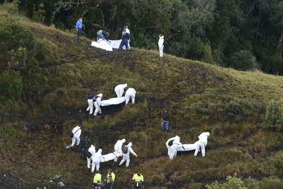  Bodies are carried on foot through the Colombian jungle