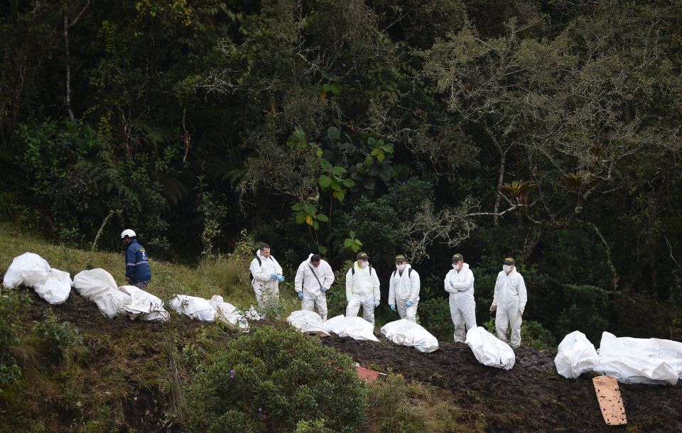  Rescue workers in this picture are outnumbered by body bags