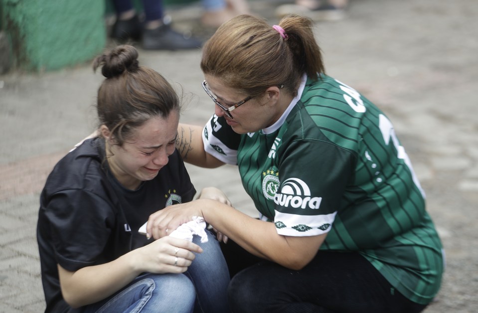  People hugged and consoled each other for support as they were overwhelmed with grief