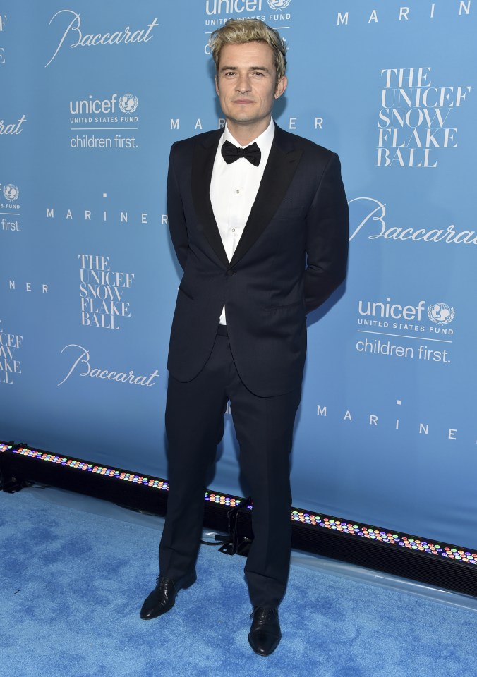 Boyfriend Orlando Bloom looked dapper in a dark blue tuxedo