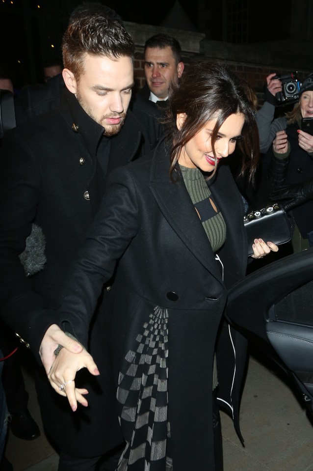  The One Direction singer guided her as she arrived at the venue