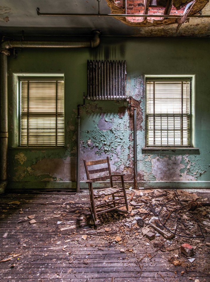  A single chair is all that remains in this room which has fallen into disrepair