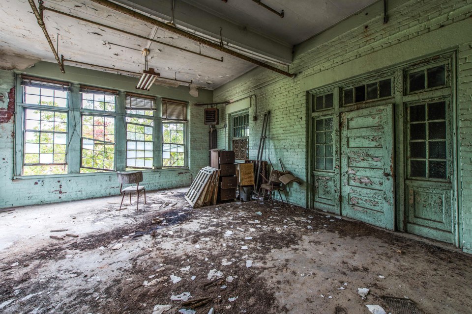  The dilapidated hospital is littered with discarded furniture and objects