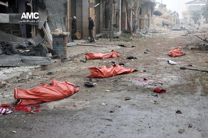  Body bags with corpses in them await a truck that travels around picking up bodies