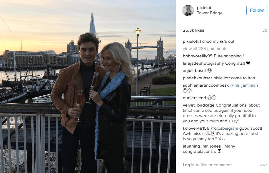  Pixie and Oliver look loved up as they share a glass of champagne after getting engaged