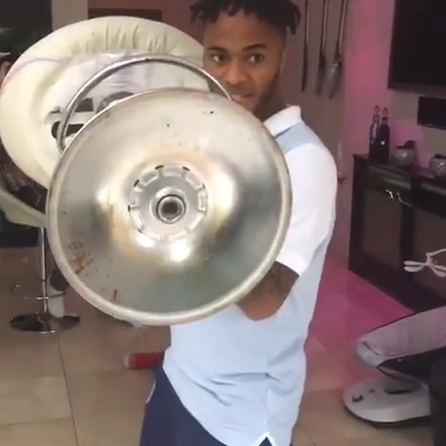  Raheem Sterling menacingly held a stool in both hands