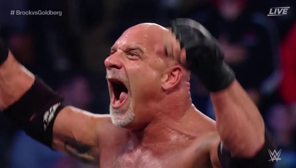  The returning Goldberg celebrates his triumph over Brock Lesnar