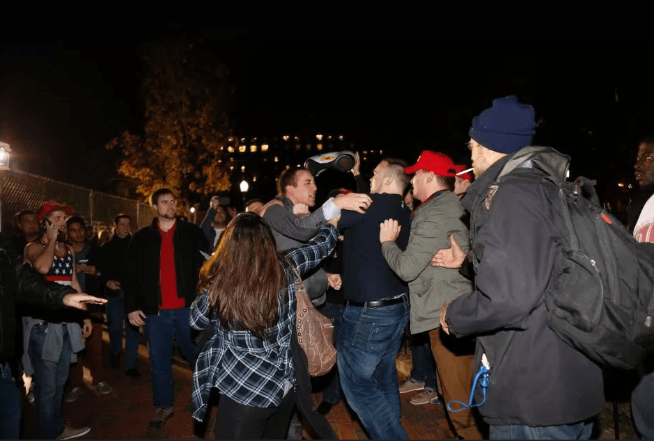  A Hillary Clinton supporter clashes with a Donald Trump supporter outside the White House